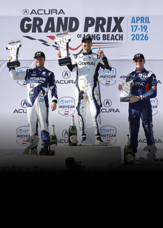 2026 Honda finishes first at the Acura Grand Prix of Long Beach, with Alex Palou celebrating on the podium.