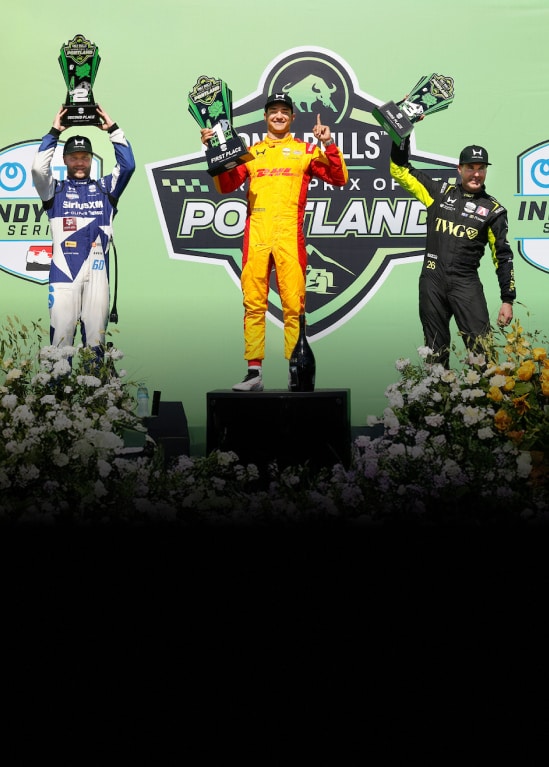 Grand Prix of Portland podium with drivers celebrating.