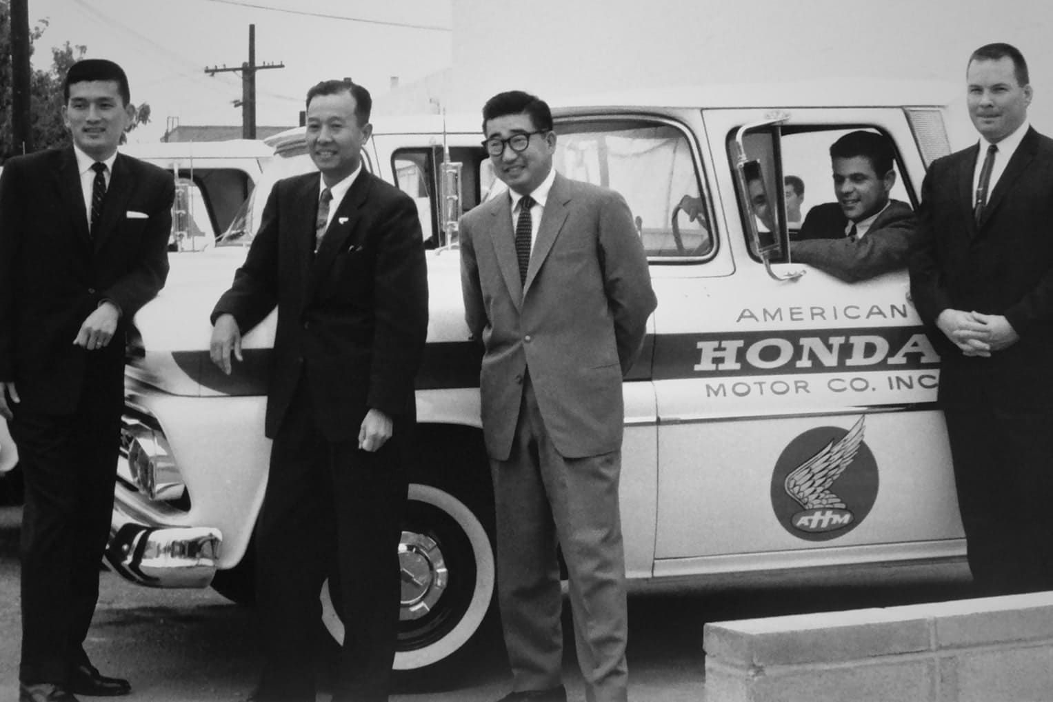 Honda employees enjoying a classic Honda truck.