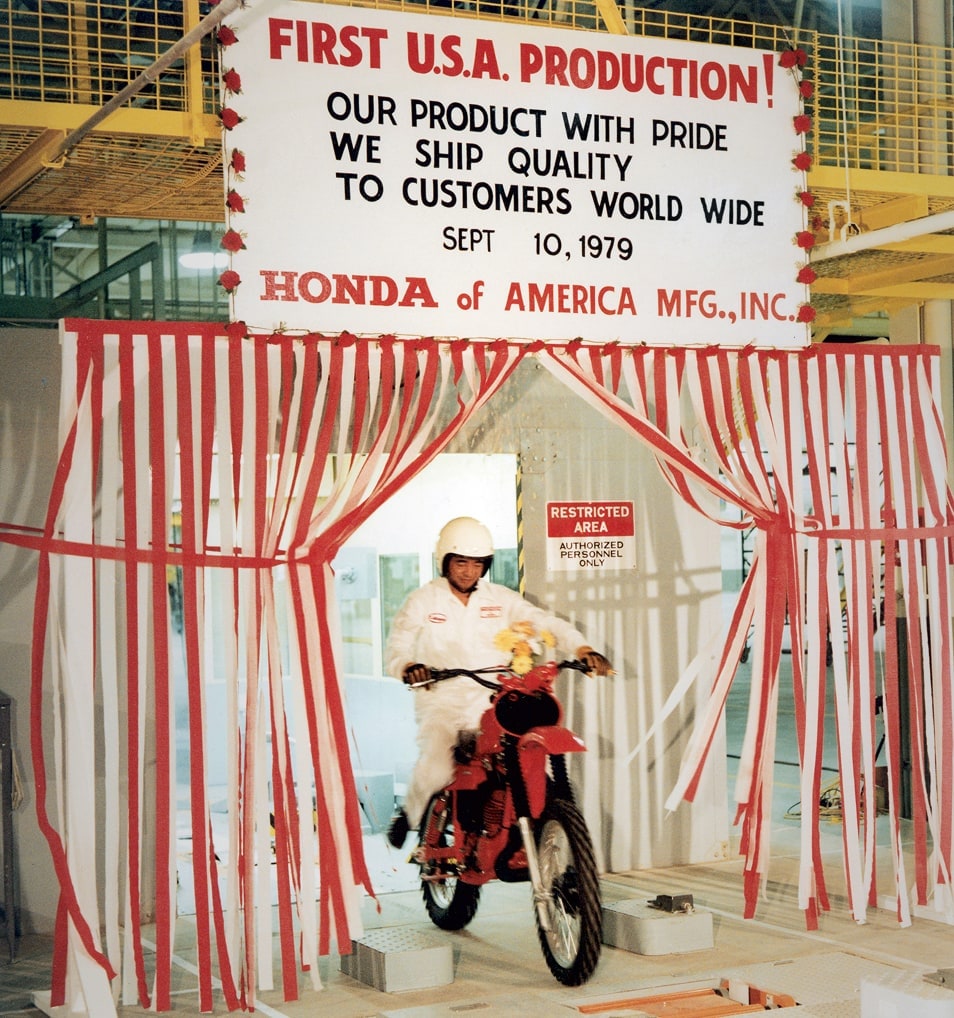 A Honda employee working on the first U.S.A. production installations, with a sign dated September 10, 1979, in the background.